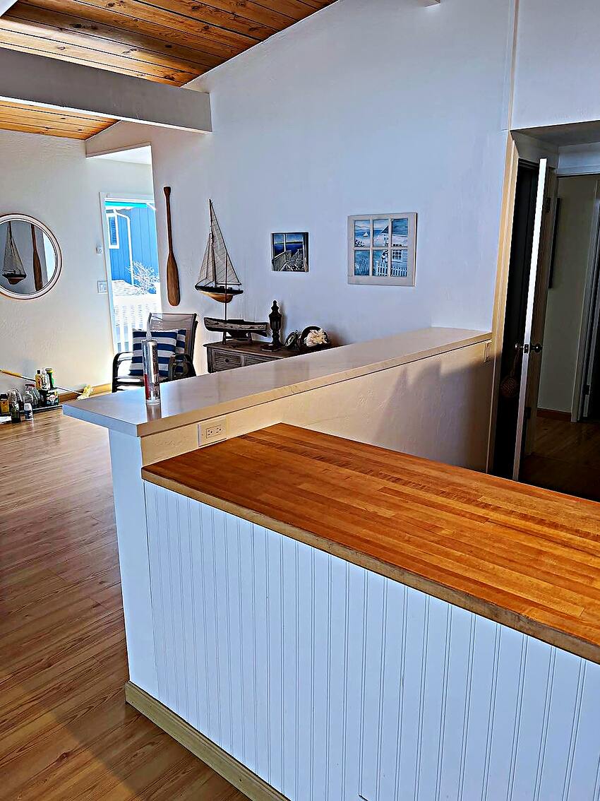 Custom wood bar top and beadboard panelling built on the Peninsula