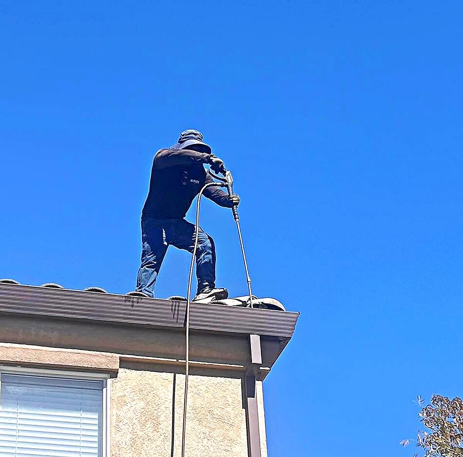 Junior Elite Services crew pressure washing a roof in the Bay Area